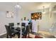 Bright dining area with a glass table, stylish chairs, and modern decor at 6321 Rolling Rose St # 201, North Las Vegas, NV 89081
