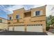 Low-rise multi-Gathering building with garages and desert landscape at 6321 Rolling Rose St # 201, North Las Vegas, NV 89081
