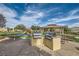 Outdoor community grilling area with picnic tables and barbeque at 6321 Rolling Rose St # 201, North Las Vegas, NV 89081