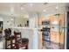 Open kitchen layout with bar seating, stainless steel appliances, and wood cabinets at 6321 Rolling Rose St # 201, North Las Vegas, NV 89081
