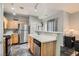 Functional kitchen with stainless steel appliances, wooden cabinets, and a sink with stainless steel faucet at 6321 Rolling Rose St # 201, North Las Vegas, NV 89081