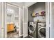 Convenient laundry area equipped with a modern washer, dryer, and ample storage at 6321 Rolling Rose St # 201, North Las Vegas, NV 89081
