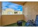 Cozy outdoor patio with seating area and views of the neighborhood at 6321 Rolling Rose St # 201, North Las Vegas, NV 89081