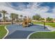 Community playground including slides and a padded ground at 6321 Rolling Rose St # 201, North Las Vegas, NV 89081