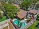Aerial view of backyard pool, patio, and home with mature trees and privacy fencing at 6436 Vinecrest Ave, Las Vegas, NV 89108