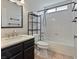 Well-maintained bathroom with a single vanity, toilet, and shower-tub combination with tile surround at 6436 Vinecrest Ave, Las Vegas, NV 89108