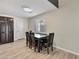 Dining area with wood table and chairs, dark cabinets and new floors at 6436 Vinecrest Ave, Las Vegas, NV 89108