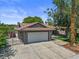 Home with spacious driveway, two-car garage, front yard, and gated side entrance at 6436 Vinecrest Ave, Las Vegas, NV 89108