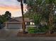 Charming single-story home featuring a well-manicured lawn, desert landscaping, and a two-car garage at 6436 Vinecrest Ave, Las Vegas, NV 89108