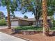 Charming single-story home featuring a well-manicured lawn, desert landscaping, and a two-car garage at 6436 Vinecrest Ave, Las Vegas, NV 89108
