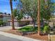 Charming single-story home featuring a well-manicured lawn, desert landscaping, and a two-car garage at 6436 Vinecrest Ave, Las Vegas, NV 89108
