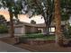 Charming single-story home featuring a well-manicured lawn, desert landscaping, and a two-car garage at 6436 Vinecrest Ave, Las Vegas, NV 89108