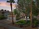 Charming single-story home with mature landscaping, a tile roof, and an attached two-car garage at 6436 Vinecrest Ave, Las Vegas, NV 89108