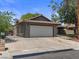 Spacious driveway with access to a two-car garage and gated side entrance at 6436 Vinecrest Ave, Las Vegas, NV 89108