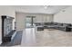 Bright living room with fireplace, new floors, access to pool area, and a large comfortable sectional sofa at 6436 Vinecrest Ave, Las Vegas, NV 89108