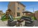 Backyard featuring a play structure and outdoor seating at 6507 Creekside Cellars Ct, Las Vegas, NV 89139