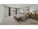 Serene bedroom featuring a comfortable bed, soft lighting, and stylish decor at 6507 Creekside Cellars Ct, Las Vegas, NV 89139
