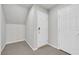 Clean entryway featuring tile flooring, white walls, and two doors for easy access and storage at 6507 Creekside Cellars Ct, Las Vegas, NV 89139