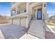 Elegant home featuring a 2-car garage, balcony, and inviting steps leading to the front door at 6507 Creekside Cellars Ct, Las Vegas, NV 89139