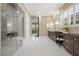 Elegant primary bathroom featuring a marble shower, dual vanity, and plantation shutters at 6700 Regency Stone Way, Las Vegas, NV 89148