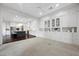 Open-concept flex room with custom built-ins and views of the kitchen at 6700 Regency Stone Way, Las Vegas, NV 89148