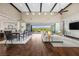 Bright living area features hardwood floors, high ceilings, and a sliding glass door at 6700 Regency Stone Way, Las Vegas, NV 89148