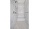 Marble tiled shower featuring dual shower heads and bench at 6700 Regency Stone Way, Las Vegas, NV 89148