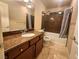 Well-appointed bathroom with granite countertop, shower and bath combination at 6729 Flamenco Ct, Las Vegas, NV 89139