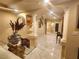 Bright hallway with marble floors, decorative columns, and glass table at 6729 Flamenco Ct, Las Vegas, NV 89139