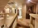 Upstairs hallway with glass railings, carpet, recessed lighting and art creating an elegant transition between spaces at 6729 Flamenco Ct, Las Vegas, NV 89139