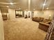 Spacious living area with plush carpeting, comfortable seating, and natural light at 6729 Flamenco Ct, Las Vegas, NV 89139