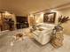Elegant living room with marble floors, plush seating, stylish decor, and a large screen television at 6729 Flamenco Ct, Las Vegas, NV 89139