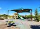 Community playground with slides and climbing equipment for Gathering fun in the sun at 6729 Flamenco Ct, Las Vegas, NV 89139