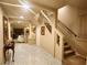 Elegant staircase leading to the upper level with marble flooring, decorative columns, and a plush carpet at 6729 Flamenco Ct, Las Vegas, NV 89139