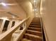 Carpeted staircase with contemporary railing leading to the upper level at 6729 Flamenco Ct, Las Vegas, NV 89139