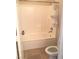 Bathroom featuring a tub with tiled walls at 6812 Dipper Ave, North Las Vegas, NV 89084