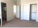 Bedroom featuring neutral walls, closet, and open doorway at 6812 Dipper Ave, North Las Vegas, NV 89084