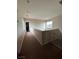 Hallway with carpet, window, and safety gate at 6812 Dipper Ave, North Las Vegas, NV 89084