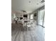 Spacious living room with stylish vinyl flooring, dining area and sliding glass doors to the backyard at 6812 Dipper Ave, North Las Vegas, NV 89084