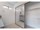 Bathroom with tile flooring, sliding mirror door, and a white interior at 7009 Rawlins Ct, Las Vegas, NV 89128