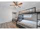 Bedroom features a ceiling fan and a bunk bed frame at 7009 Rawlins Ct, Las Vegas, NV 89128