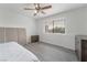 Bedroom with wood-look flooring, dresser and window at 7009 Rawlins Ct, Las Vegas, NV 89128