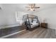 Bedroom with bunk beds, ceiling fan and wood-look flooring at 7009 Rawlins Ct, Las Vegas, NV 89128