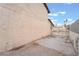 Wide driveway on side of home with gated access to backyard and ample parking at 7009 Rawlins Ct, Las Vegas, NV 89128
