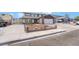 Inviting two-story home featuring a spacious driveway and a well-maintained front yard at 7009 Rawlins Ct, Las Vegas, NV 89128