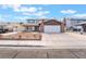 Inviting two-story home featuring a spacious driveway and a well-maintained front yard at 7009 Rawlins Ct, Las Vegas, NV 89128
