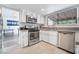 Bright kitchen featuring stainless steel appliances, and ample natural light at 7009 Rawlins Ct, Las Vegas, NV 89128