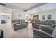 Open-concept living room with access to the kitchen and a back door at 7009 Rawlins Ct, Las Vegas, NV 89128