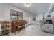 Cozy living room with a piano and fireplace at 7009 Rawlins Ct, Las Vegas, NV 89128