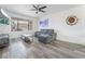 Modern living room featuring sleek hardwood floors and stylish contemporary furnishings at 7009 Rawlins Ct, Las Vegas, NV 89128